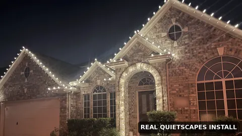 Real QuietScapes install: warm white C9 lights on the same brick home